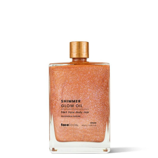 Face Facts Shimmer Glow Oil 100ml glass bottle with gold cap — vegan 3-in-1 illuminating golden shimmer oil for face, body, and hair
